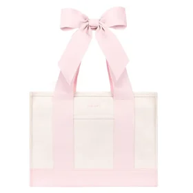 A light pink and white tote bag with wide pink shoulder straps and a large matching pink bow at the top, shown on a plain white background. #color_ballet pink bow
