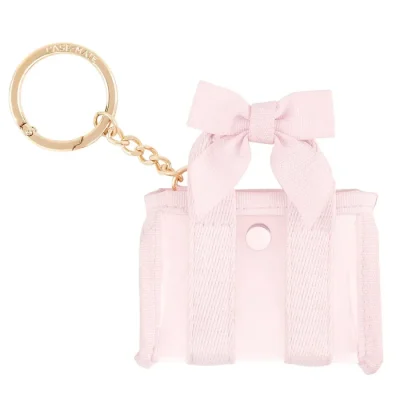 Pink hair ties with a bow and gold keychain on a white background #color_ballet pink bow