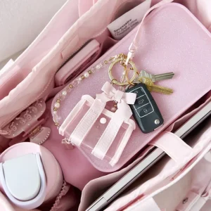 Pink keychain with keys on a pink surface #color_ballet pink bow