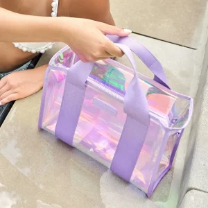 Person holding a transparent purple bag with iridescent accents on a concrete surface #color_iridescent