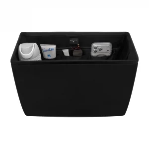 Black storage ottoman with various items on a white background #color_midnight black