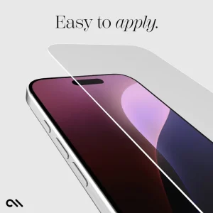 Clear glass screen protector being applied to iPhone 16 with colorful gradient display visible underneath.