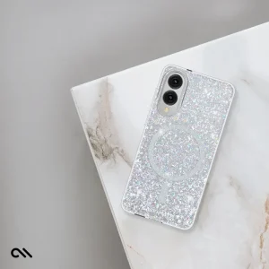 Galaxy S25 Edge case with iridescent glitter interior, circular magnet ring, and dual camera cutout on white marble surface.